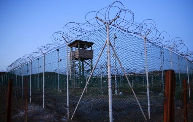 Chain link fence and concertina wire surrounds a deserted guard tower within Joint Task Force Guantanamo's Camp Delta at the U.S. Naval Base in Guantanamo Bay, Cuba March 21, 2016.