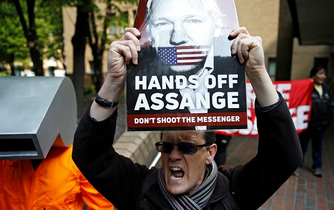 People protest outside Southwark Crown Court where WikiLeaks founder Julian Assange will be sentenced, in London