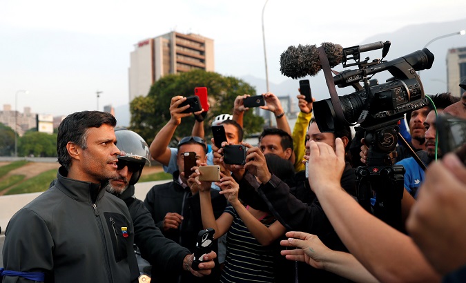 Venezuelan opposition leader Leopoldo Lopez talks to the media outside Generalisimo Francisco de Miranda Airbase 