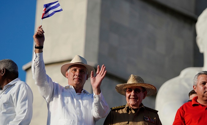 President Miguel Diaz-Canel (L) and Communist Party First Secretary Raul Castro (R) watch Labor Day parade in Havana, Cuba May 1, 2019.