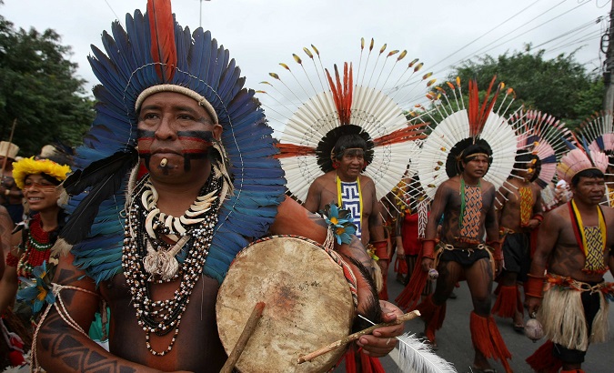 Brazilian Indigenouspeople march together during a demonstration in Rio de Janeiro.