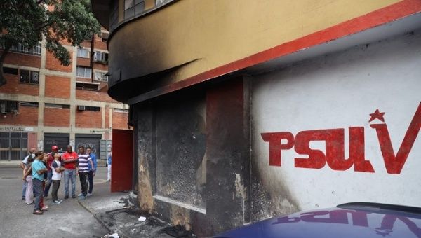 The local PSUV headquarters in the working-class neighborhood of San Agustin was targeted Saturday morning when several tires were set on fire outside the building.