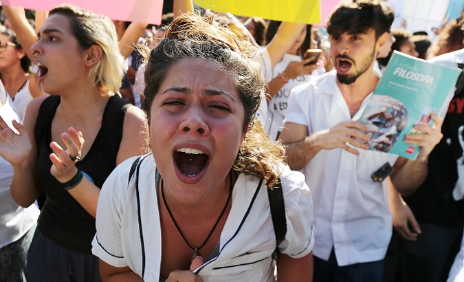 A student from Pedro II federal school reacts during a protest against Brazil's President Jair Bolsonaro in front of the Military school in Rio de Janeiro, Brazil May 6, 2019.