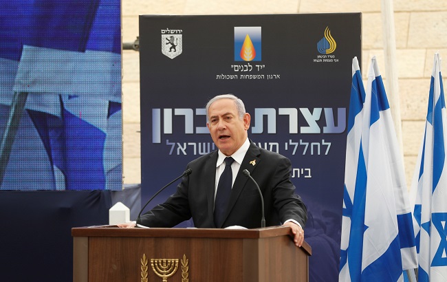 Israeli Prime Minister Benjamin Netanyahu speaks during a ceremony marking Memorial Day, which commemorates the fallen soldiers of Israel, at a monument in Jerusalem