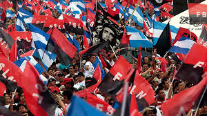 A march showing people waving the Nicaraguan flag