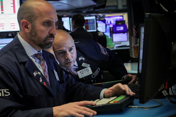 Traders work on the floor at the New York Stock Exchange (NYSE) in New York, U.S., May 13, 2019.
