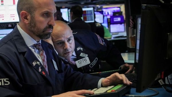 Traders work on the floor at the New York Stock Exchange (NYSE) in New York, U.S., May 13, 2019.
