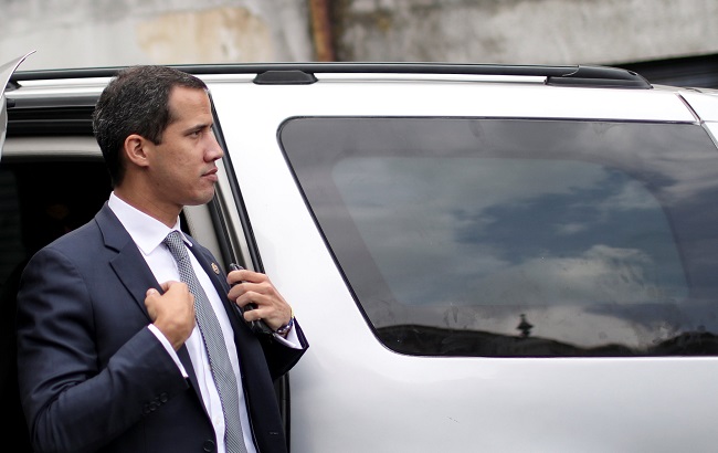 Venezuelan opposition leader Juan Guaido arrives in Caracas for a news conference.