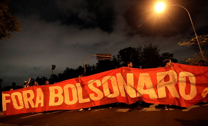 Brazilians protest against education-related budget cuts in Sao Paulo, Brazil May 15, 2019. The banner reads 'Out Bolsonaro.'