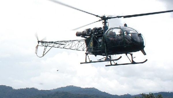 A Peruvian Army helicopter flies in the air.