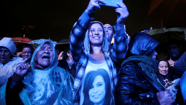 People wait for Argentina's former President Cristina Fernandez de Kirchner presentation of her book 