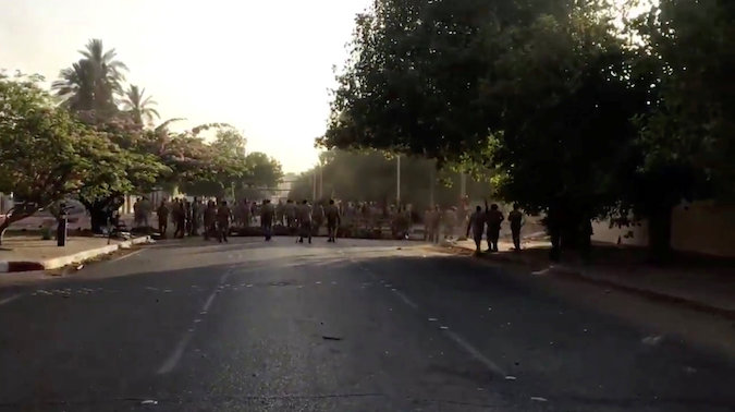 Shots are fired by Sudanese forces during a protest in Khartoum, Sudan May 15, 2019 in this still image taken from a video obtained from social media.