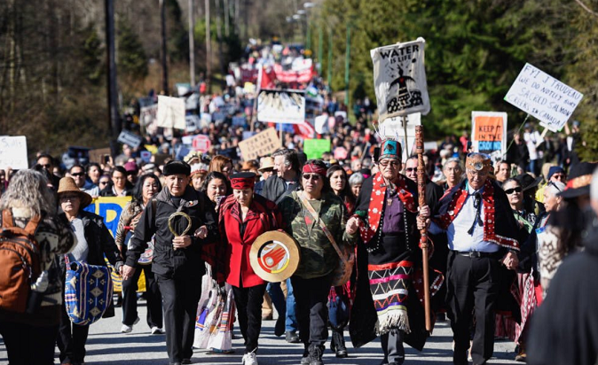Protesters from the Tsleil-Waututh Nation demonstrate against the proposed expansion to the TransMountain Pipeline in British Colombia.