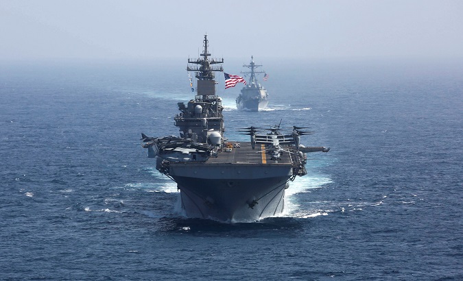 U.S. Navy assault ship Kearsarge and missile destroyer USS Bainbridge sail in the Arabian Sea, May 17, 2019.