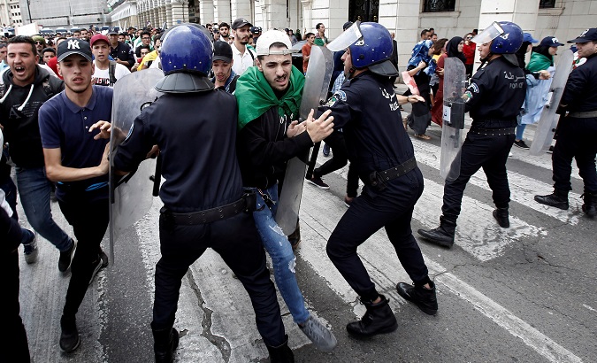 Students and police confront each other during an anti government protest in Algiers, Algeria, May 19, 2019.