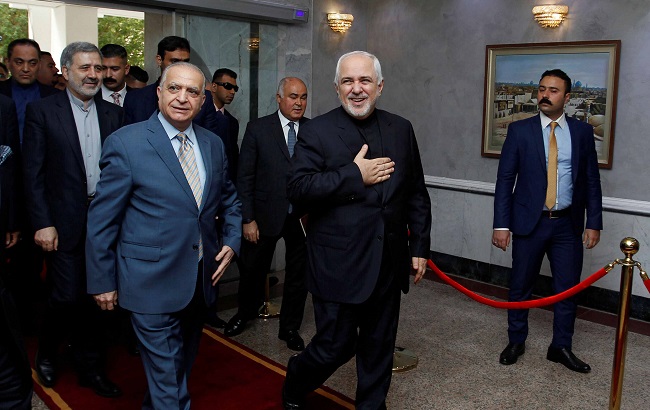 Iranian Foreign Minister Mohammad Javad Zarif (R), walks with Iraqi Foreign Minister Mohamed Ali al-Hakim (L) in Baghdad, Iraq, May 26, 2019.