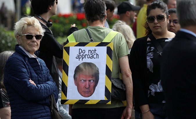 A protester wears a placard near Buckingham Palace during U.S. President Donald Trump’s state visit to Britain in London, Britain, June 3, 2019