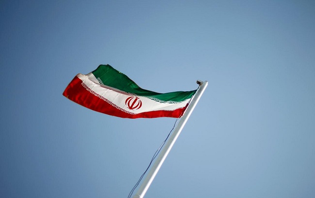 An Iranian national flag flutters during the opening ceremony of the 16th International Oil, Gas & Petrochemical Exhibition (IOGPE) in Tehran April 15, 2011.