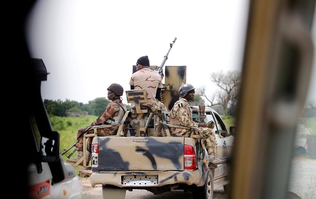 A Nigerian army convoy vehicle drives ahead with an anti-aircraft gun, on its way to Bama, Borno State, Nigeria August 31, 2016.