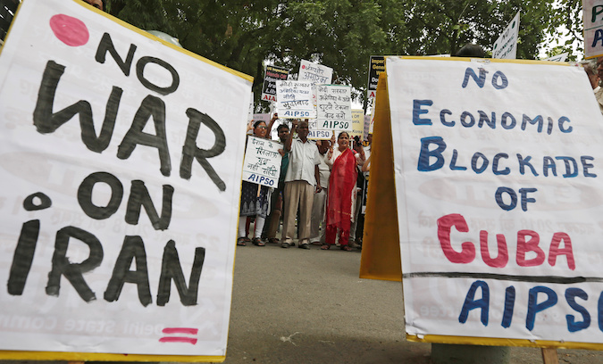 Demonstrators shout slogans as they hold placards during a protest against U.S. Secretary of State Mike Pompeo's visit to India, in New Delhi, India, June 25, 2019.