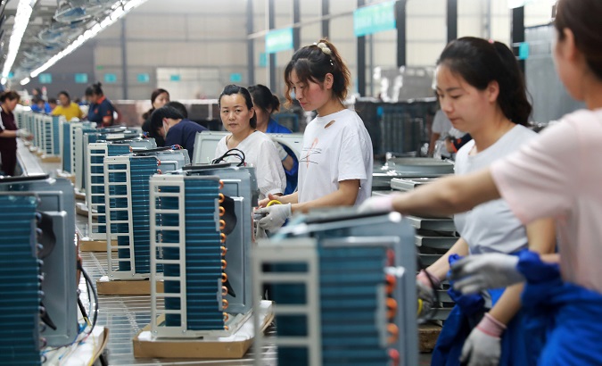 Women at an electrical engineering company in Huaibei, Anhui province, China May 30, 2019.