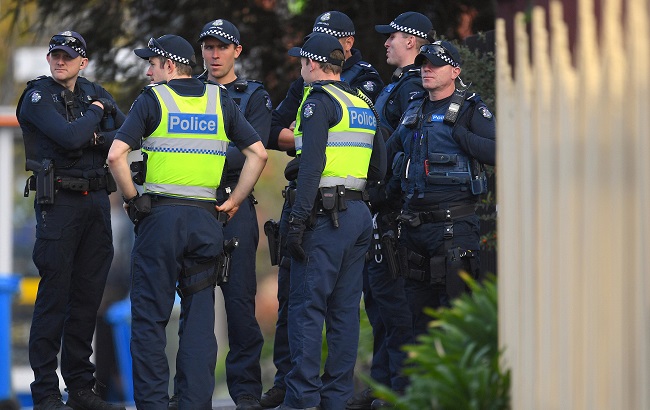 Australian police stand at the site of a siege at the Buckingham Serviced Apartments in Melbourne, Australia, June 6, 2017.