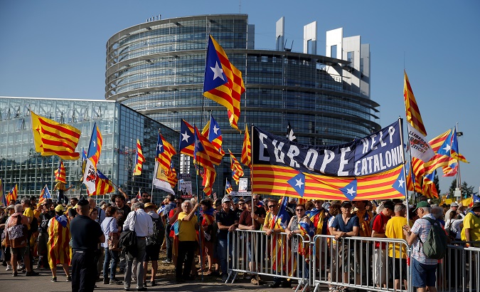 Protesters hold Catalan flags during a demonstration in front of the European Parliament in Strasbourg, France, July 2, 2019.