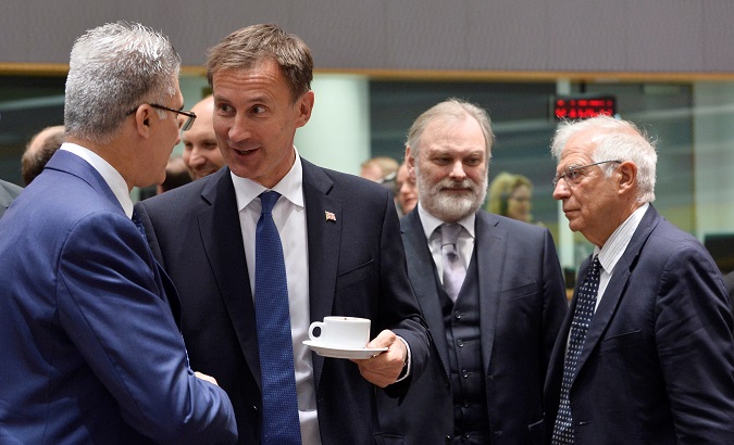 Malta's Foreign Minister Carmelo Abela talks with his British counterpart Jeremy Hunt during a EU foreign ministers meeting in Brussels, Belgium July 15, 2019.