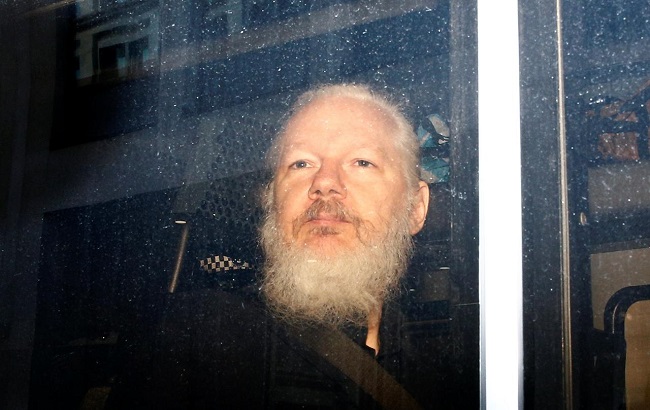 WikiLeaks founder Julian Assange is seen in a police van, after he was arrested by British police, in London, Britain April 11, 2019