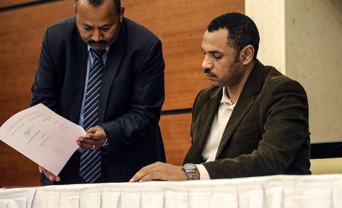 Sudan's opposition alliance coalition's leader Ahmad al-Rabiah signs a political accord as part of a power-sharing deal aimed at leading the country to democracy following three decades of autocratic rule in Khartoum, Sudan July 17, 2019.