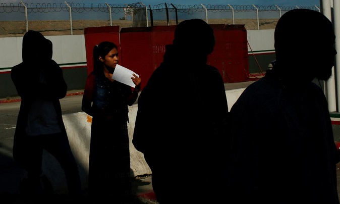 Asylum seekers in line at El Chaparral port of entry, between Mexico and the United States border in Tijuana, Mexico, July 20, 2019.