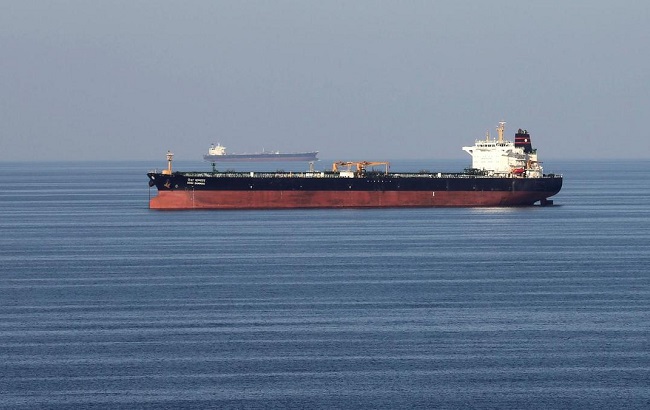 An unidentified oil tankers pass through the Strait of Hormuz.