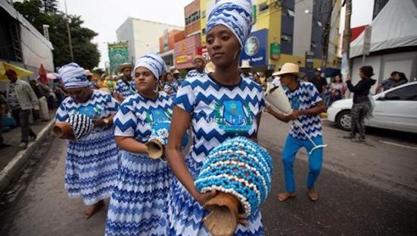 Members of Maracatu Nacao Raizes de Pai performing in the streets of Garanhuns on July 21, 2019.