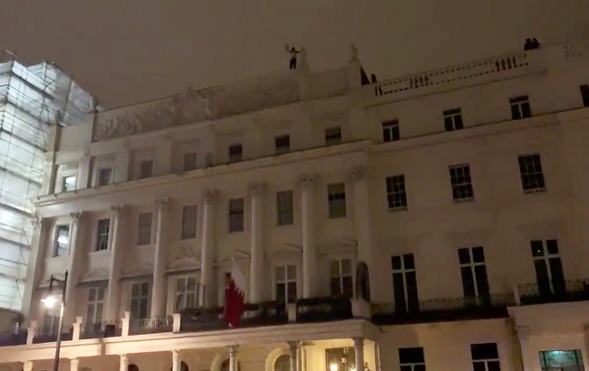 A man is seen on the roof of Bahrain's Embassy in London, Britain, July 26, 2019 in this still picture obtained from social media video by Reuters on July 27, 2019.