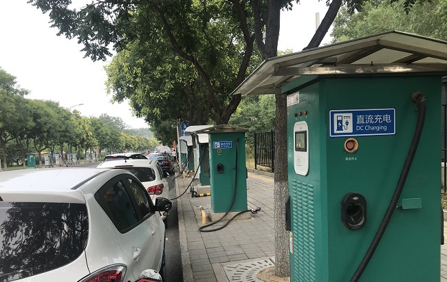 Electric vehicles at a public charging service area in Beijing, capital of China, on July 15, 2019.