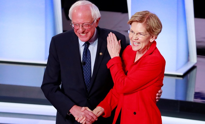 U.S. Senators Bernie Sanders and Elizabeth Warren shake hands before the start of he second 2020 Democratic presidential debate.