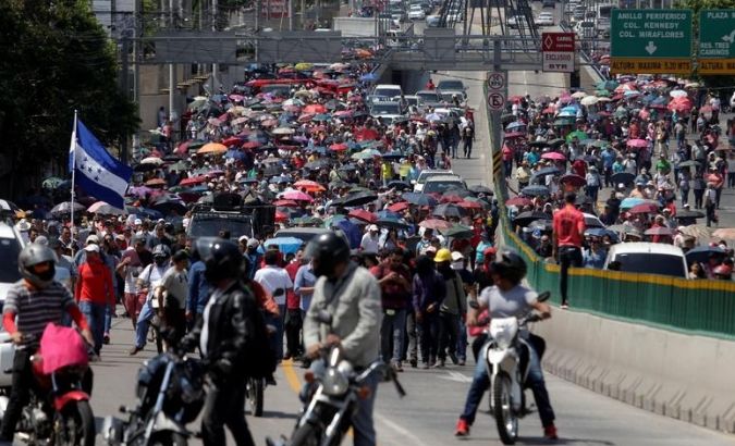 Demonstrators march to protest against government plans to privatize healthcare and education, in Tegucigalpa, Honduras April 30, 2019.