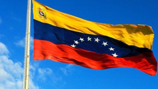 The Venezuelan flag waves proudly in the wind.