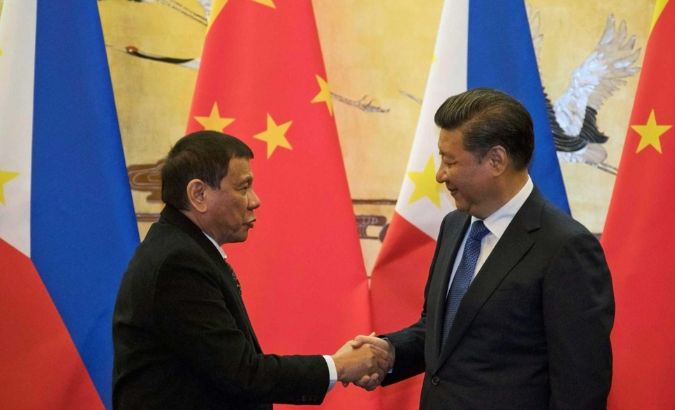 Philippine President Rodrigo Duterte and Chinese President Xi Jinping shake hands after a signing ceremony in Beijing, China.