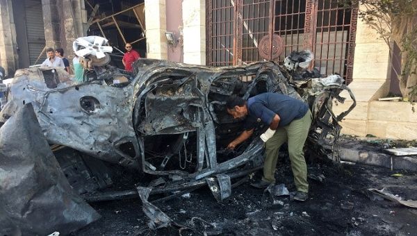 A security official inspects the site where a car bomb exploded in Benghazi, Libya August 10, 2019.