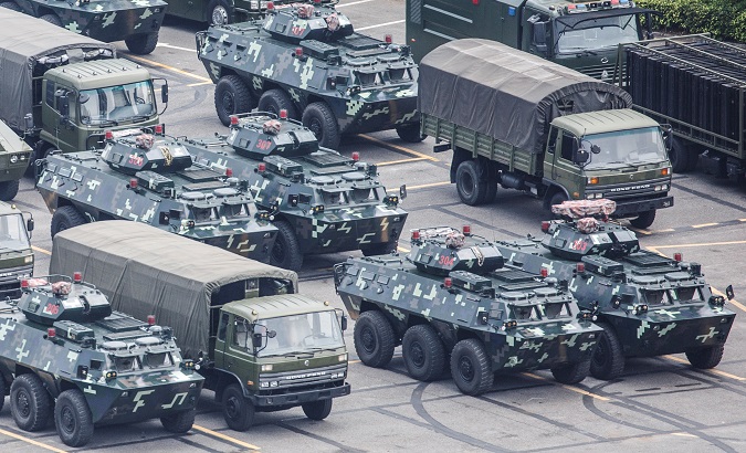 Military vehicles parked at the Shenzhen Bay Sports Center in Shenzhen, China August 15, 2019.