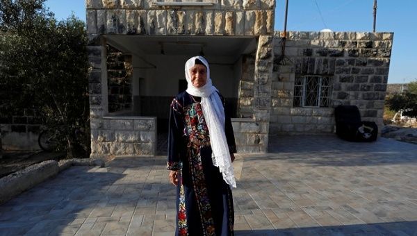 Muftia, the grandmother of U.S. congresswoman Rashida Tlaib, poses for a photo in front of her house in the village of Beit Ur Al-Fauqa in the Israeli-occupied West Bank August 16, 2019. Picture taken August 16, 2019. 