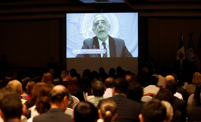 Ivan Velasquez is seen speaking on a screen at the presentation of the CICIG's latest report in Guatemala City, Guatemala August 20, 2019.
