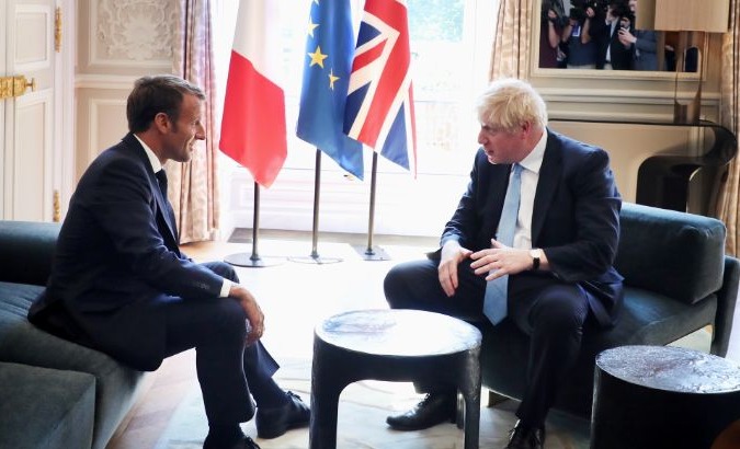 French President Emmanuel Macron and British Prime Minister Boris Johnson speak during a meeting at the Elysee Palace in Paris, France, August 22, 2019.