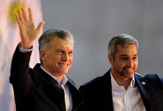 Paraguay's President Mario Abdo Benitez and his Argentine counterpart Mauricio Macri attend a ceremony in Ayolas