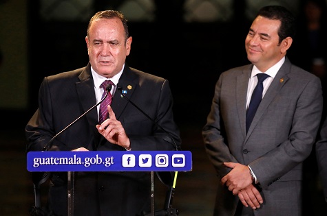 Guatemala's President-elect Alejandro Giammattei and outgoing Guatemala's President Jimmy Morales during a news conference in Guatemala City.