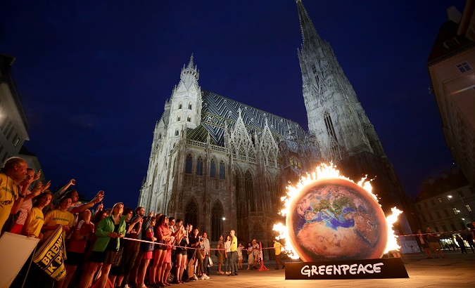 Human rights defenders and environment activists protest against Amazon deforestation at St. Stephen's Cathedral in Vienna, Austria, August 26, 2019.