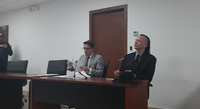 Carlos Soria, lawyer to Ola Bini and Ola Bini in a court Thursday in Quito, Ecuador, Aug. 29, 2019