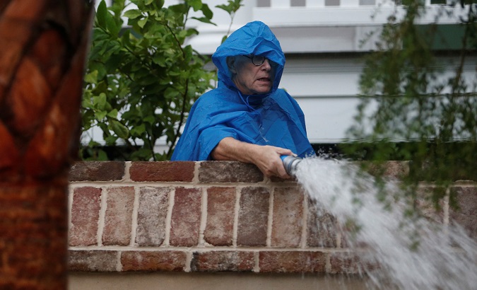 Resident pumps water from the yard of his home during Hurricane Dorian in Charleston, South Carolina, U.S., Sep. 5, 2019.