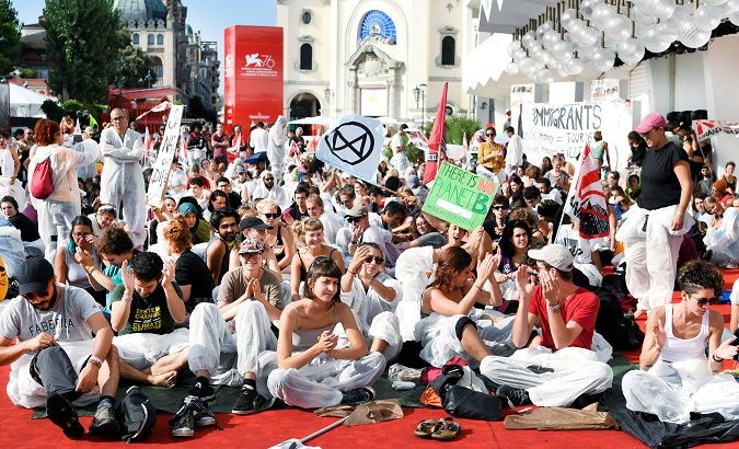 Climate activists protest at the 76th annual Venice International Film Festival, in Venice, Italy, Sep. 7, 2019.